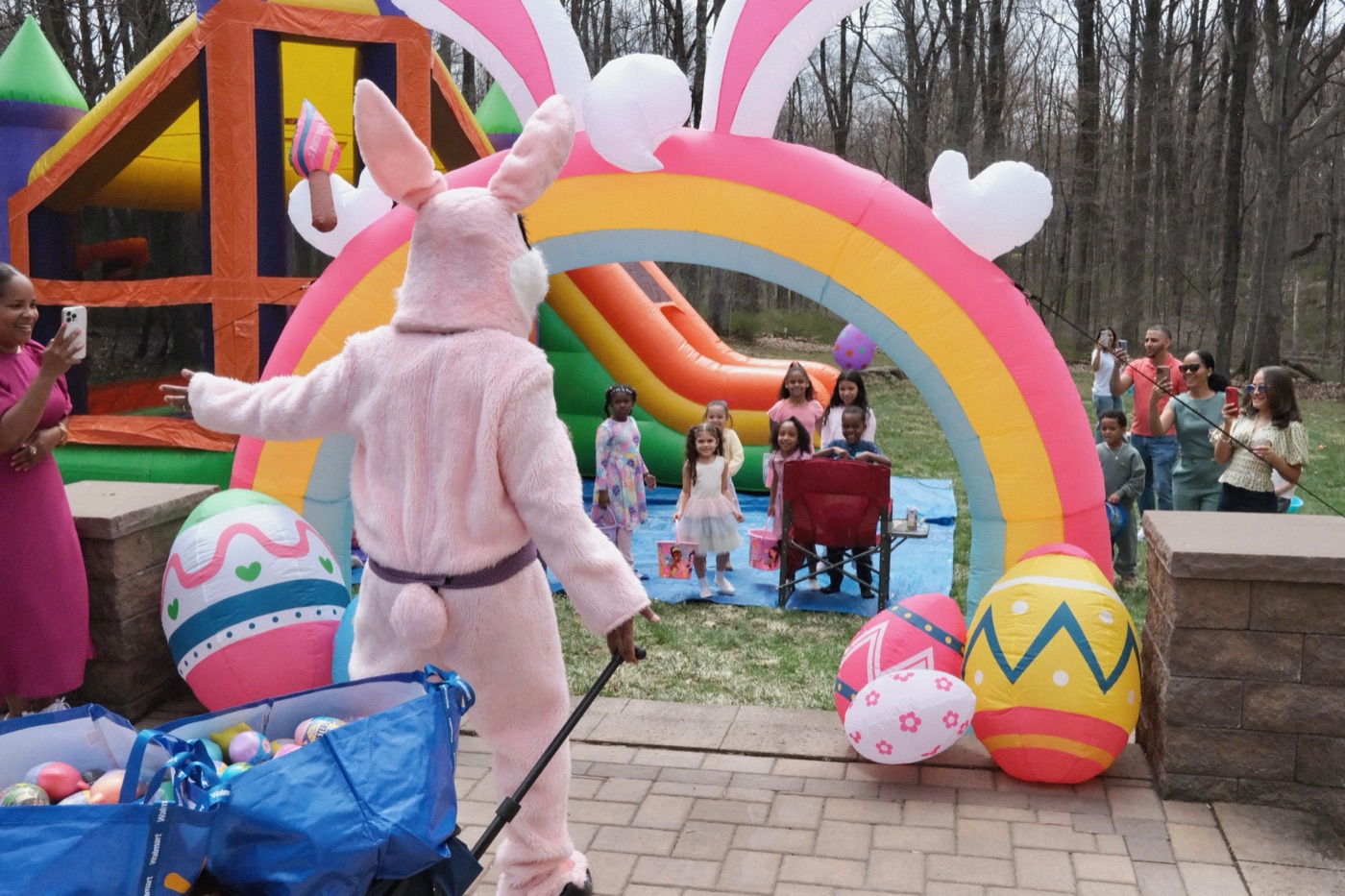 Castle-style inflatable bounce house with attached slide; promotional product image with labeled dimensions 19 feet long by 15 feet wide by 16 feet tall